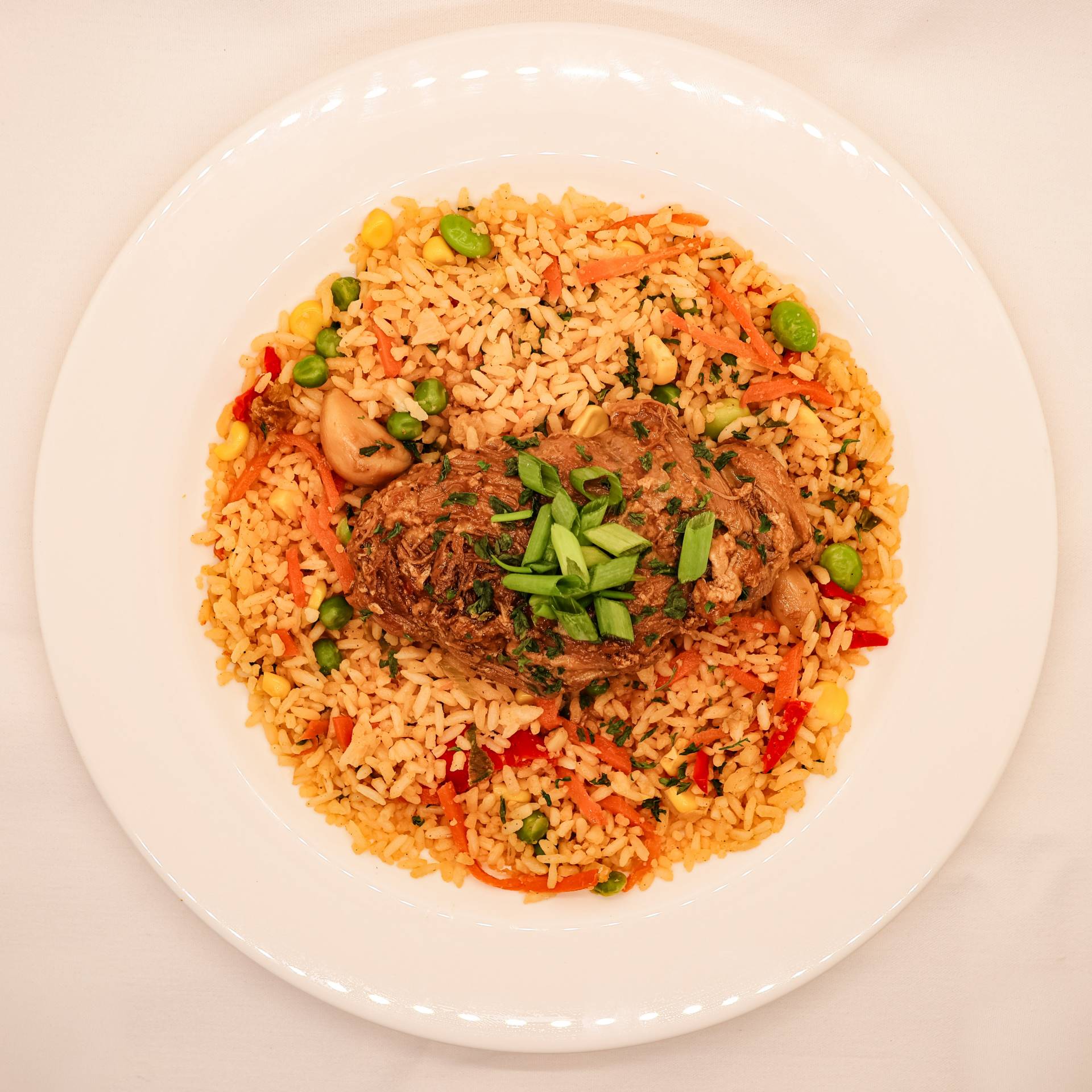 Chicken Adobo Thighs on Vegetable Fried Rice