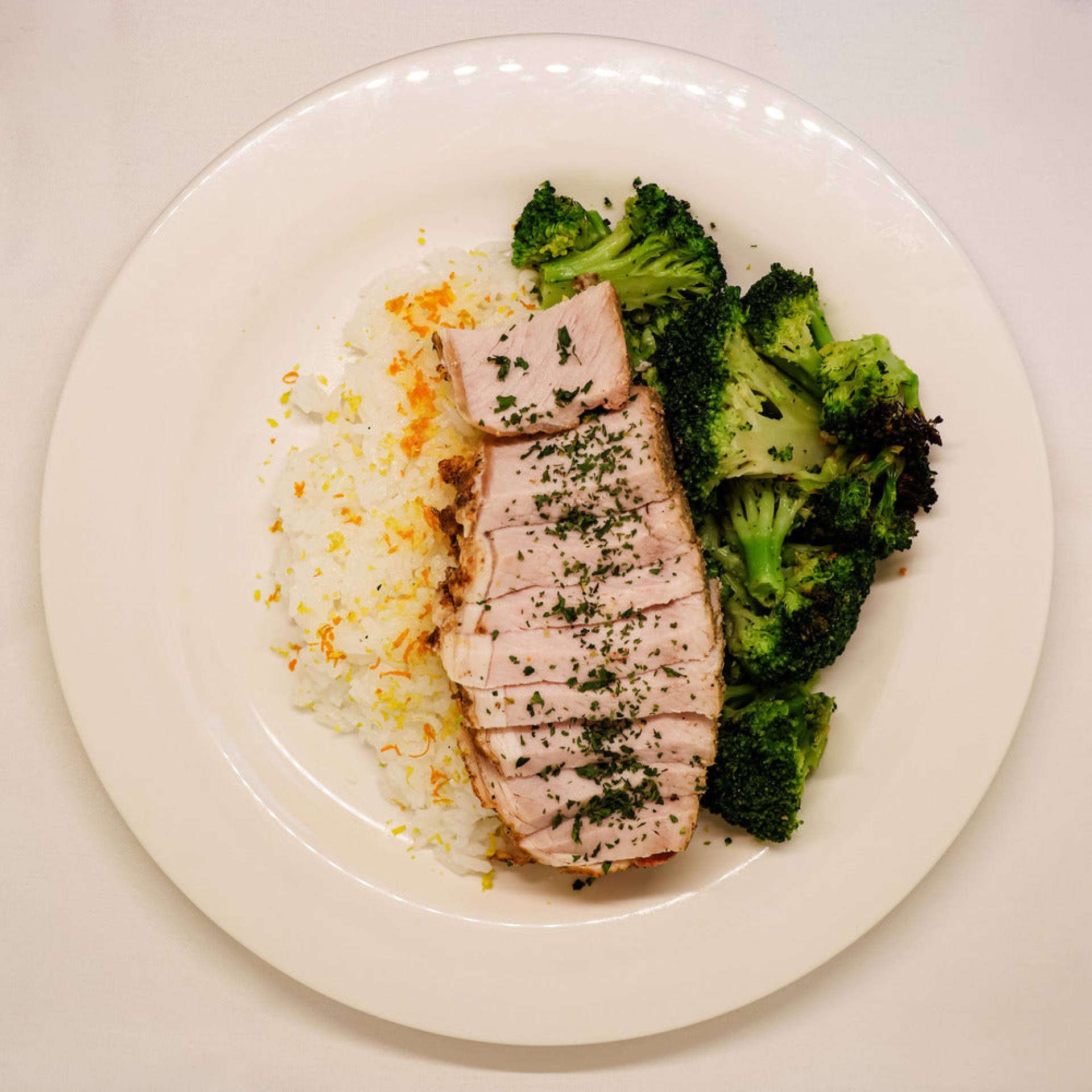 Herb Roasted Pork Loin on Citrus Rice with Roasted Broccoli