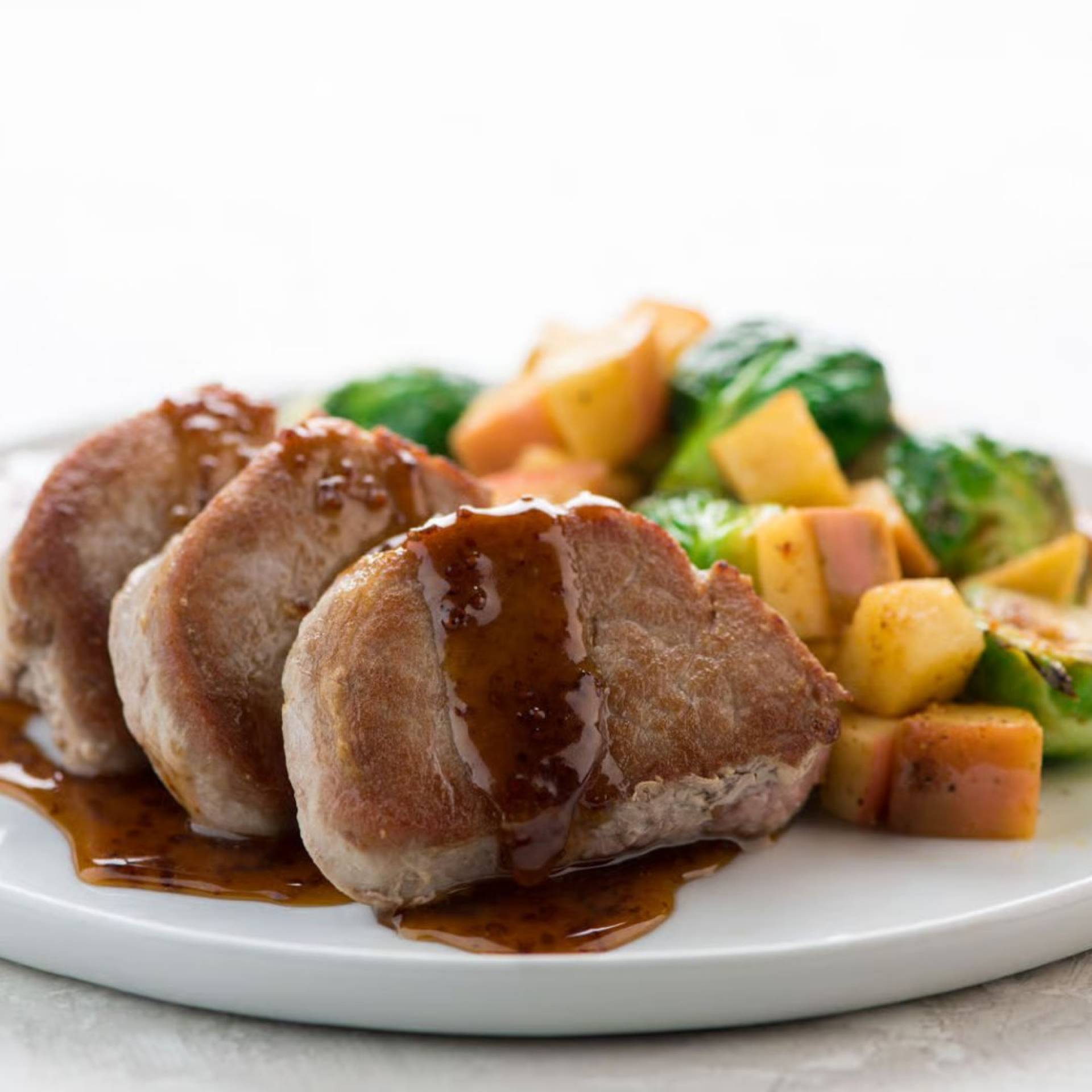 Apple Cider Glazed Pork Tenderloin Medallions with Roasted Apples and Brussels sprouts